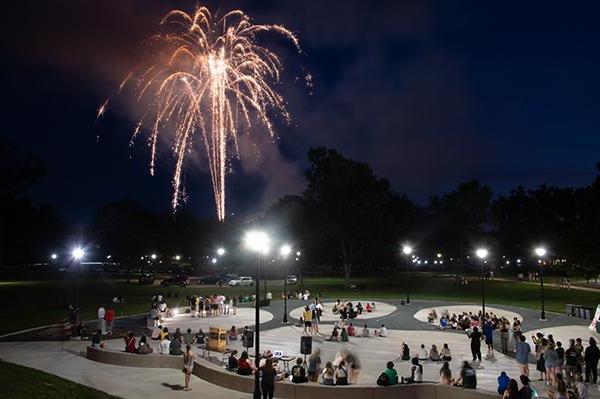 Students watch fireworks at Paw Print Park as part of the Bobcat Block Party.