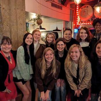 Students pose for a photo in a venue in London.